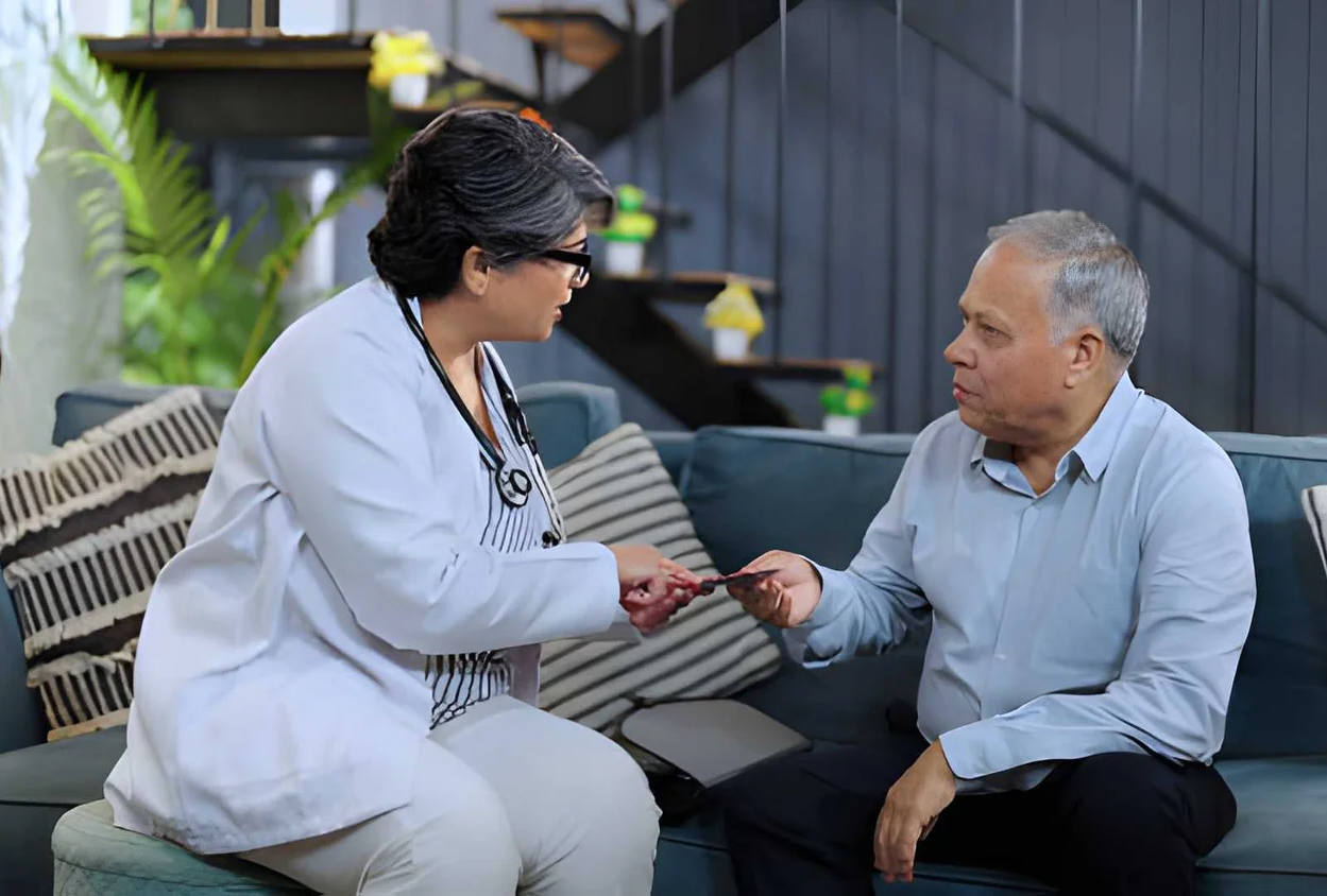 Caregiver supporting an elderly man